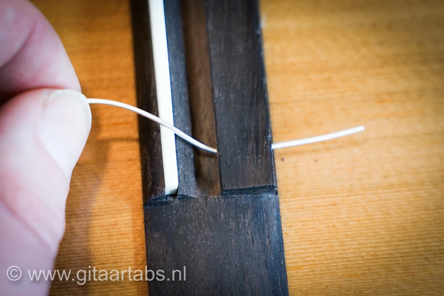 6e snaar door het zadel